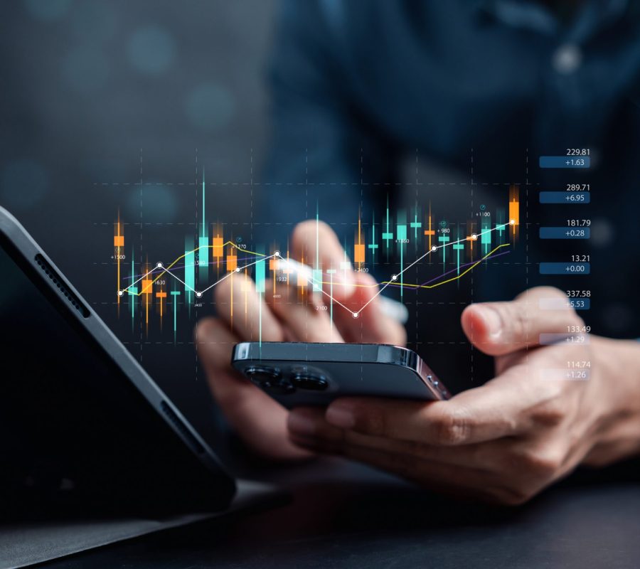 Businessmen investor think before buying stock market investment using smartphone to analyze trading data. investor analysis with stock exchange graph on screen. Financial stock market.