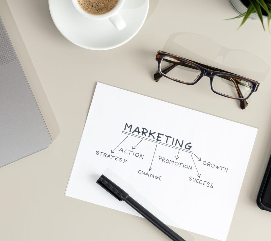 Strategy Marketing planning concept. Flat lay of Working desk with planning document sketch